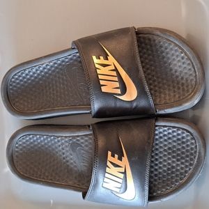 Black and Gold size 7 Nike slides